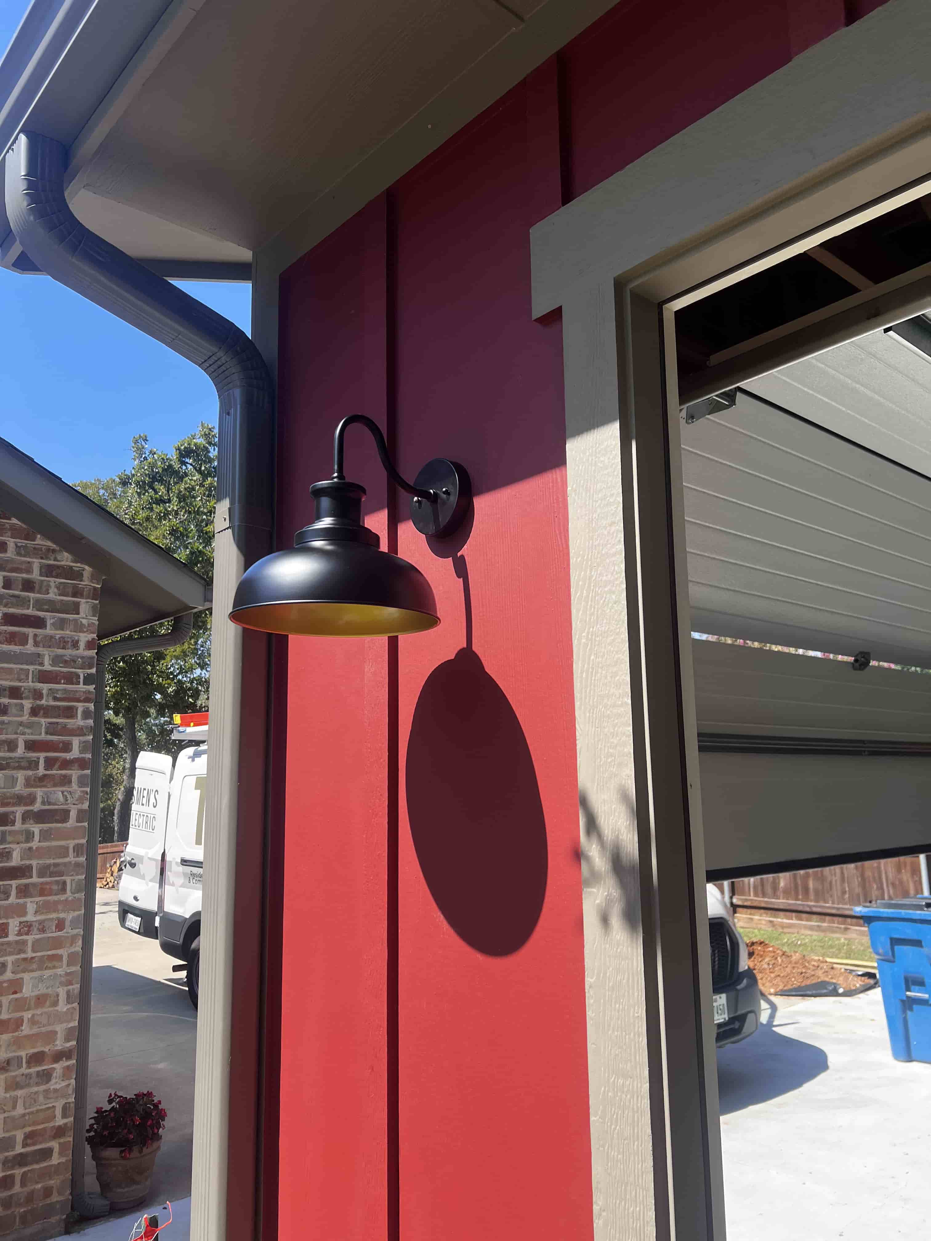 Installed sleek outdoor lighting for a newly built garage.