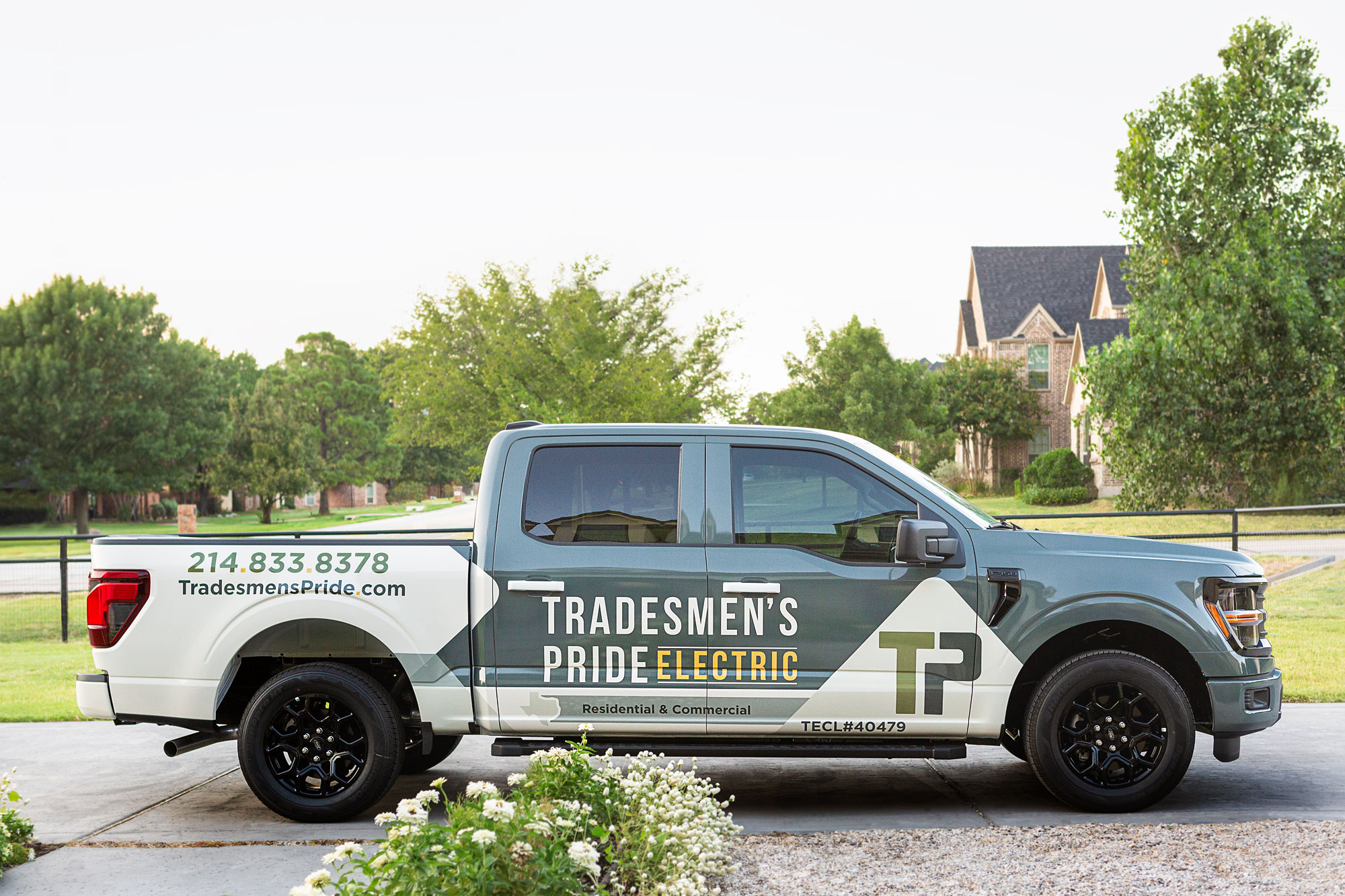 Tradesmen's Pride service van in front of a home