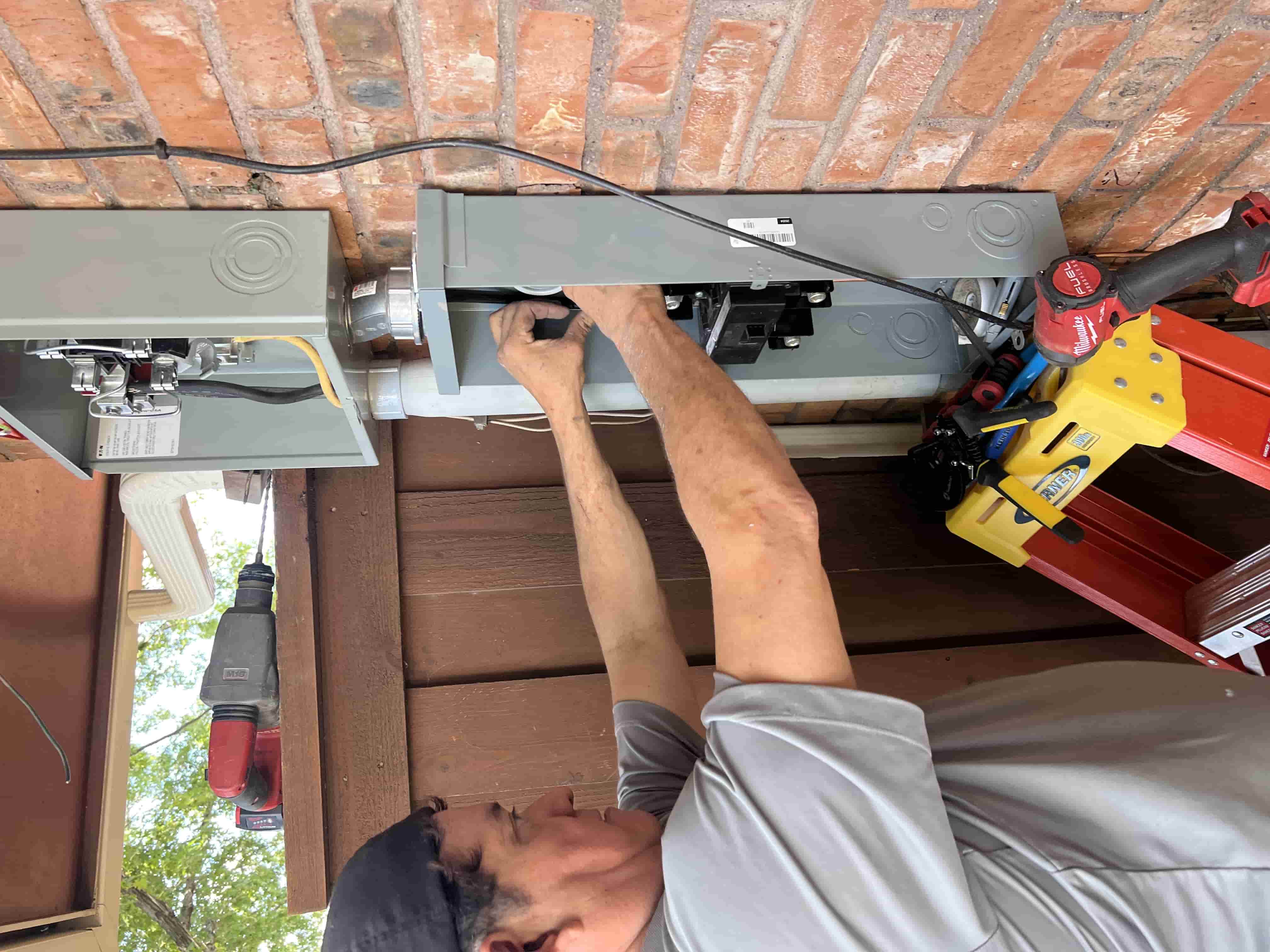 Julian from Tradesmen’s Pride installing the new outdoor disconnect