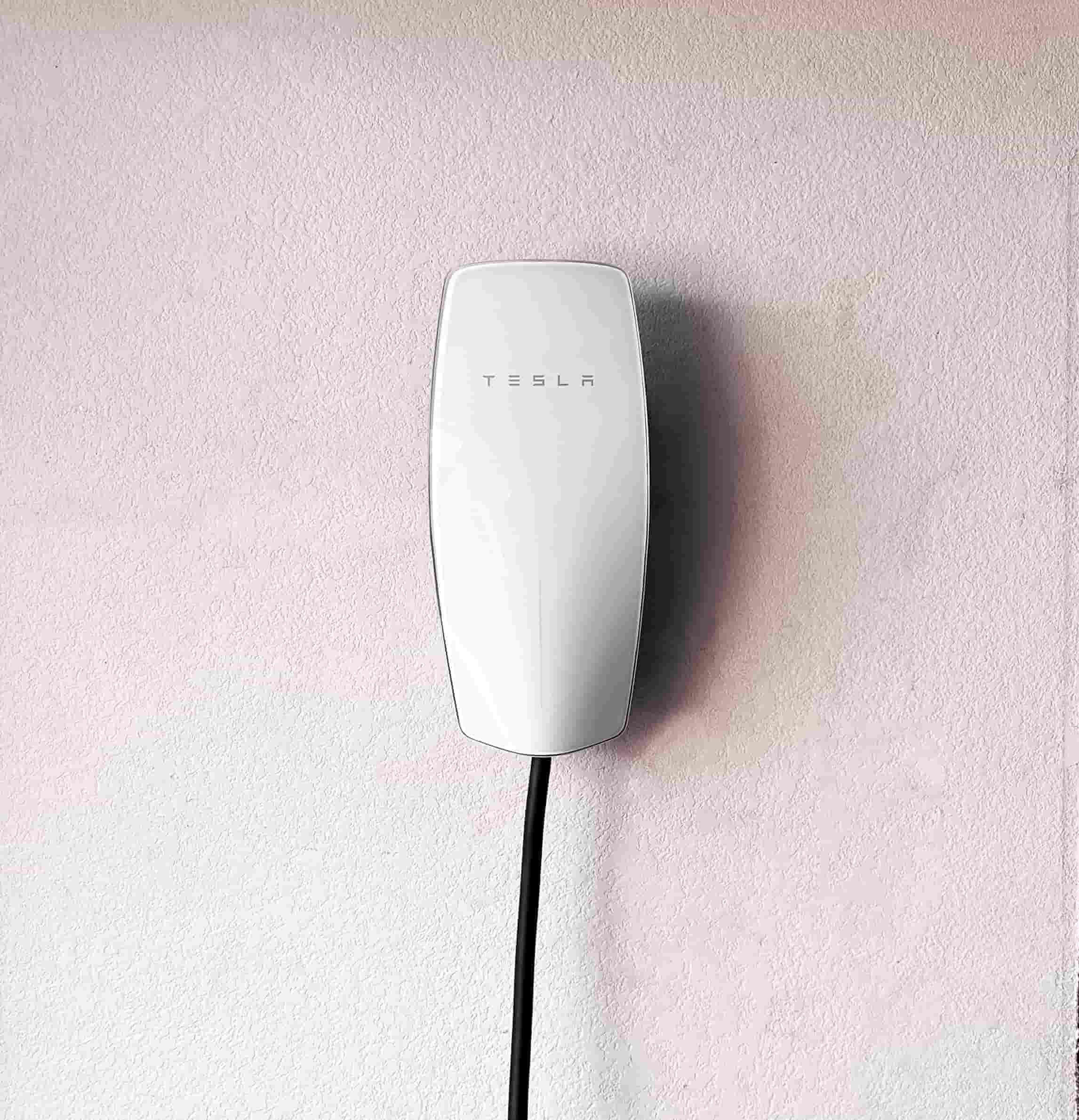 Wall-mounted EV charger installation in a home garage